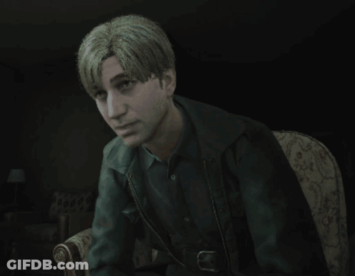 A Man With Blonde Hair Is Sitting In A Chair With His Eyes Closed GIF