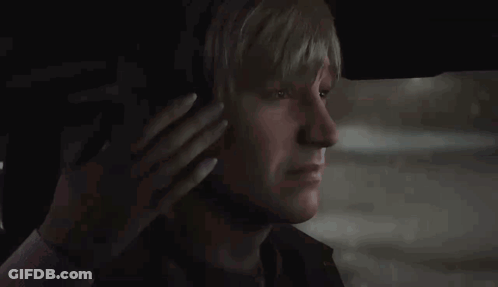 A Man With Blonde Hair Is Sitting In The Back Seat Of A Car . GIF