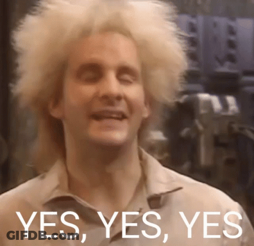 A Man With Blonde Hair Is Smiling With The Words Yes Yes Yes Behind Him GIF