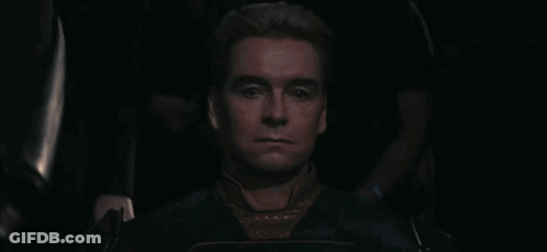 A Man With Blonde Hair Is Wearing A Blue Shirt GIF