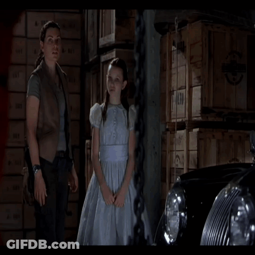 A Man With Blood On His Face Is Holding A Flashlight GIF