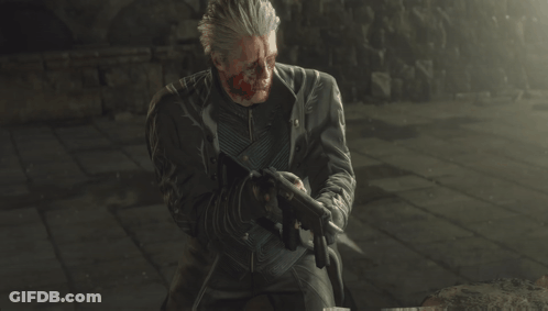A Man With Blood On His Face Is Holding A Gun In His Hand GIF