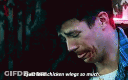A Man With Blood On His Face Is Saying I Just Love Chicken Wings So Much . GIF