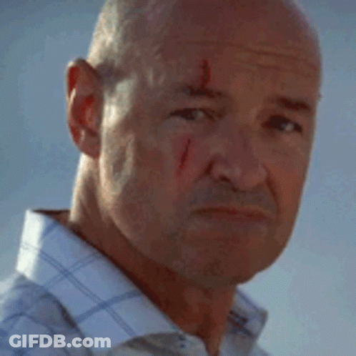 A Man With Blood On His Face Is Smiling GIF