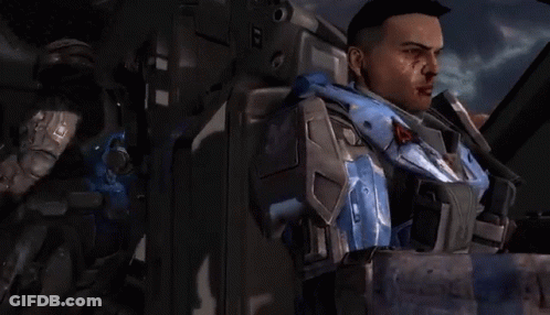 A Man With Blood On His Face Is Standing Next To Another Man With Blood On His Face GIF