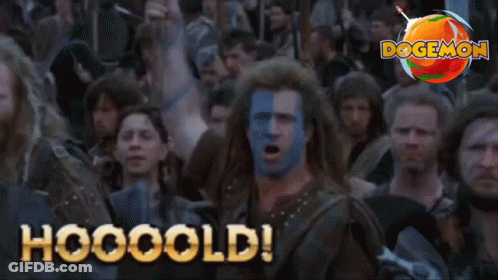 A Man With Blue And White Paint On His Face Says Hooooold In Front Of A Crowd Of People GIF