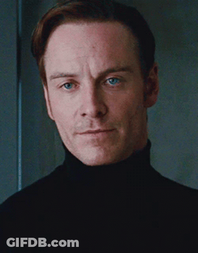 A Man With Blue Eyes And A Black Turtleneck GIF