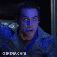 A Man With Blue Eyes Is Screaming With The Words Deal Behind Him GIF