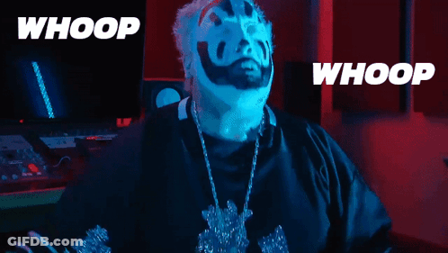 A Man With Blue Face Paint And A Necklace With The Words Whoop On The Bottom GIF