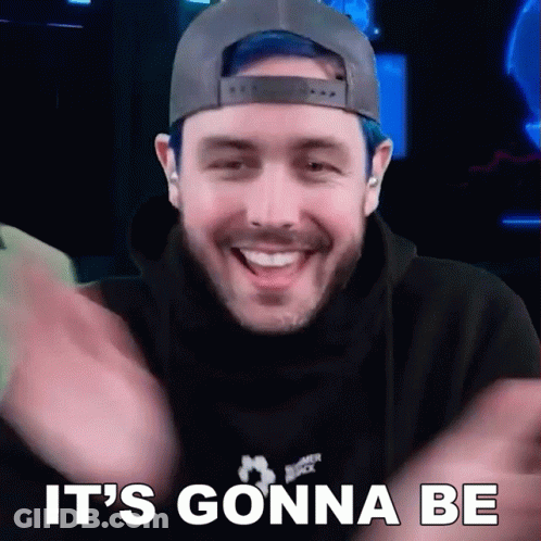 A Man With Blue Hair And A Hat Is Smiling And Says It 'S Gonna Be . GIF