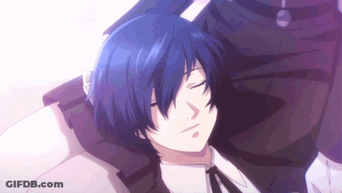 A Man With Blue Hair Is Laying On A Bed With His Eyes Closed GIF
