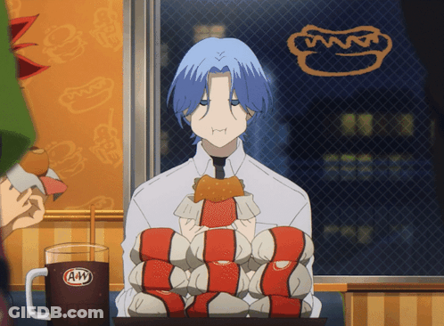 A Man With Blue Hair Is Sitting At A Table With A Mug Of A&w GIF