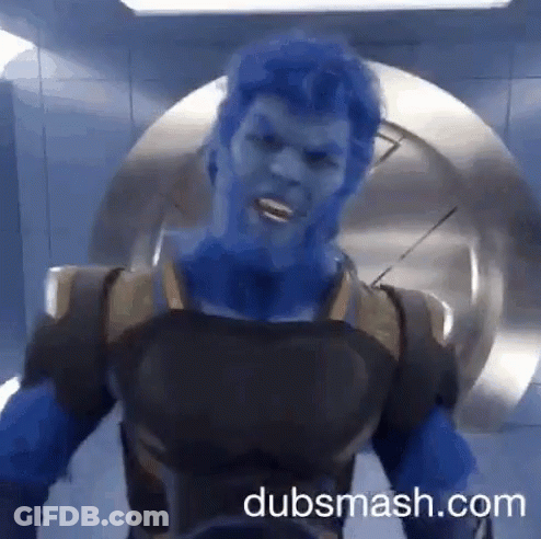 A Man With Blue Hair Is Standing In Front Of A Door With Dubsmash.com On The Bottom GIF