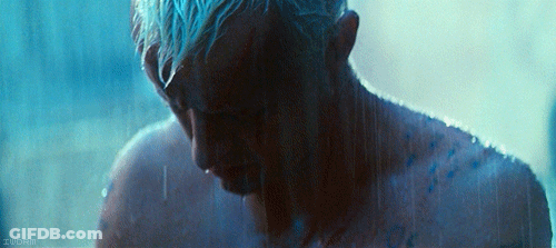 A Man With Blue Hair Is Taking A Shower In A Dark Room With A Watermark That Says Zuorin GIF
