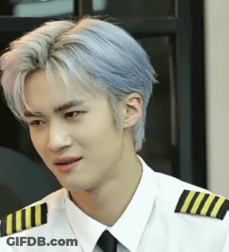 A Man With Blue Hair Is Wearing A White Shirt And Black Tie GIF