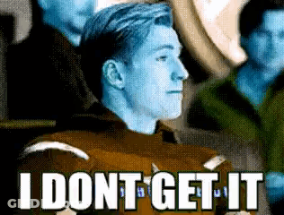 A Man With Blue Hair Says " I Dont Get It " While Sitting In A Crowd GIF