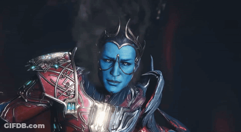 A Man With Blue Paint On His Face And Glasses GIF