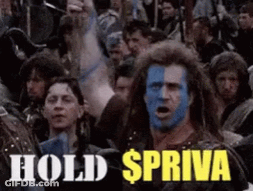 A Man With Blue Paint On His Face Is Standing In Front Of A Crowd And Says Hold Spriva GIF