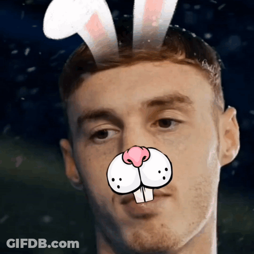 A Man With Bunny Ears On His Head And A Cartoon Nose GIF