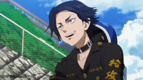 A Man With Chinese Writing On His Sleeves Is Smiling GIF