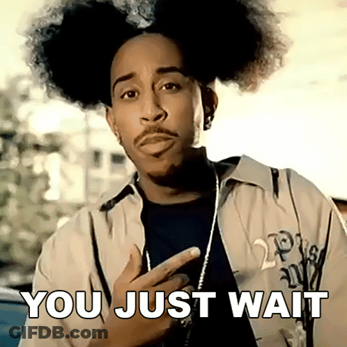 A Man With Curly Hair And A Beard Has The Words You Just Wait Written On His Face GIF
