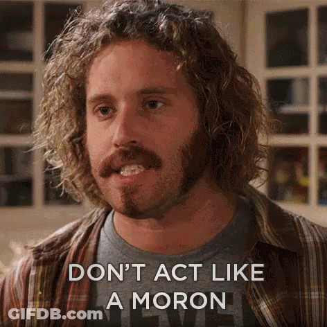 A Man With Curly Hair And A Beard Is Saying " Don 'T Act Like A Moron " GIF
