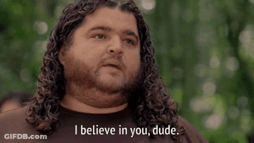 A Man With Curly Hair And A Beard Says " I Believe In You Dude " GIF
