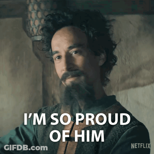 A Man With Curly Hair And A Beard Says " I 'M So Proud Of Him " GIF