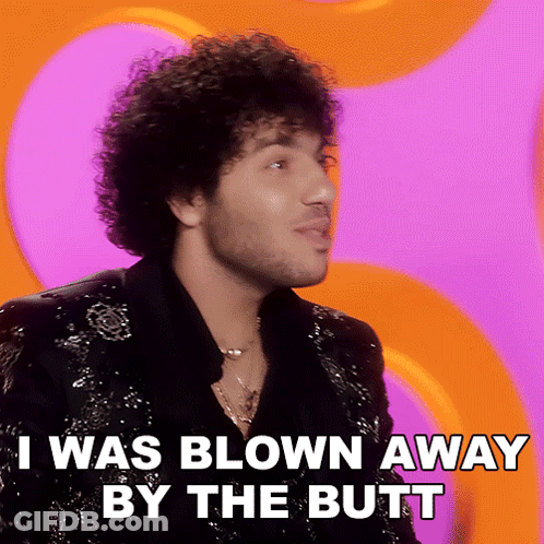 A Man With Curly Hair And A Beard Says I Was Blown Away By The Butt GIF
