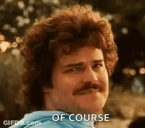 A Man With Curly Hair And A Mustache Is Making A Face And Saying `` Of Course '' . GIF