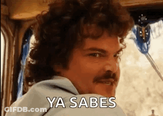 A Man With Curly Hair And A Mustache Is Sitting In A Car And Saying Ya Sabes . GIF