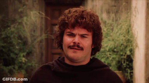 A Man With Curly Hair And A Mustache Is Wearing A Black Sweater GIF