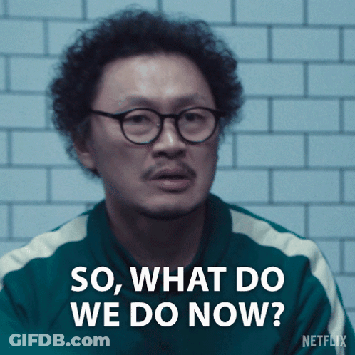 A Man With Curly Hair And Glasses Is Asking " So What Do We Do Now " GIF