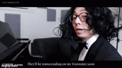 A Man With Curly Hair And Glasses Is Playing A Piano And Says They 'Ll Be Transcending On My Totetanz Soon GIF