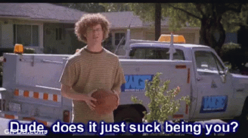 A Man With Curly Hair Is Holding A Basketball In Front Of A Truck That Says Dude Does It Just Suck Being You GIF