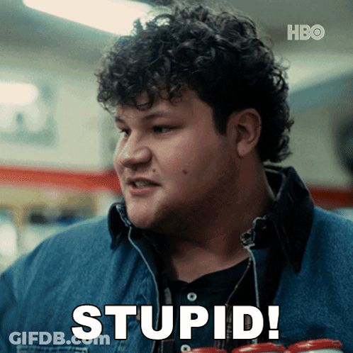 A Man With Curly Hair Is Holding A Can Of Soda And Saying Stupid GIF