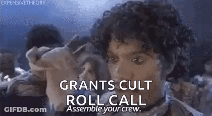 A Man With Curly Hair Is Holding A Pig And Says `` Grants Cult Roll Call Assembly Your Crew '' . GIF