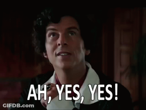 A Man With Curly Hair Is Making A Funny Face And Saying `` Ah , Yes , Yes ! '' GIF