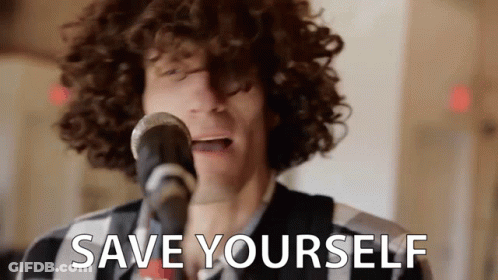 A Man With Curly Hair Is Singing Into A Microphone With The Words `` Save Yourself '' Written Below Him . GIF