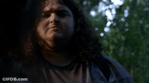 A Man With Curly Hair Is Smiling With The Words I Want Some Friggin Written Below Him GIF