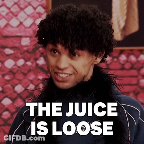 A Man With Curly Hair Is Smiling With The Words " The Juice Is Loose " Behind Him GIF