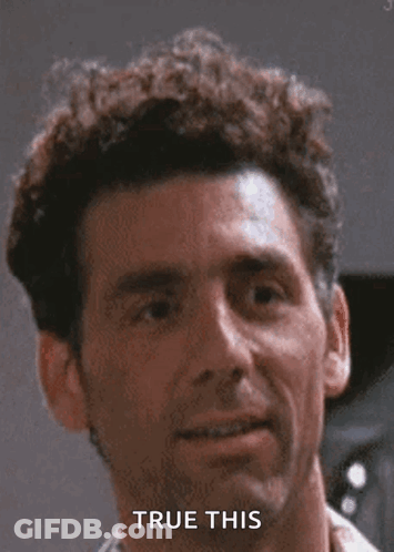 Curly-Haired Man Smiling With True This Text GIF