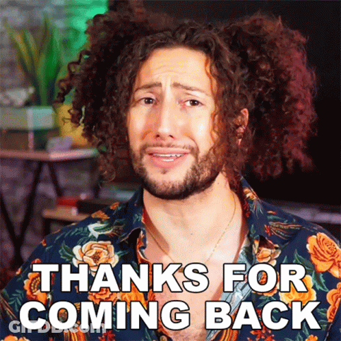 A Man With Curly Hair Is Wearing A Floral Shirt That Says Thanks For Coming Back GIF
