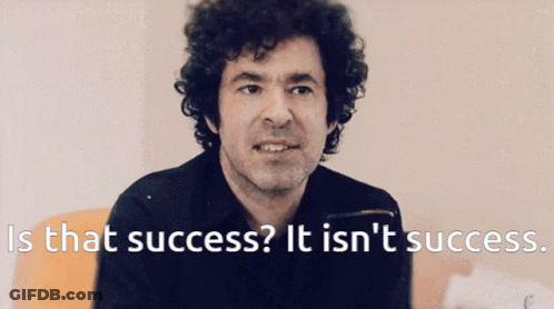 A Man With Curly Hair Says " Is That Success " GIF