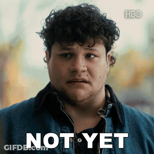 A Man With Curly Hair Says Not Yet GIF