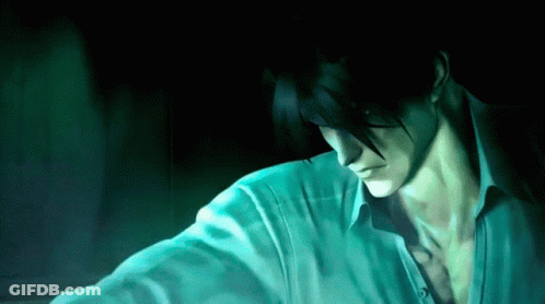 A Man With Dark Hair And A White Shirt Looks Down GIF