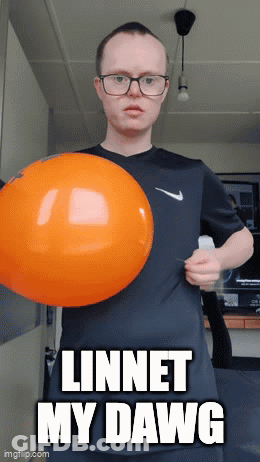 A Man With Down Syndrome Is Holding An Orange Balloon And Says " Linnet My Dawg " On The Bottom GIF