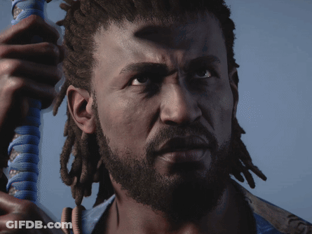 A Man With Dreadlocks And A Beard Holds A Blue Object In His Hand GIF