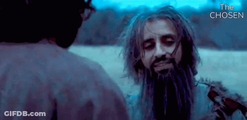 A Man With Dreadlocks And A Beard Is Talking To Another Man In A Movie Called The Chosen GIF