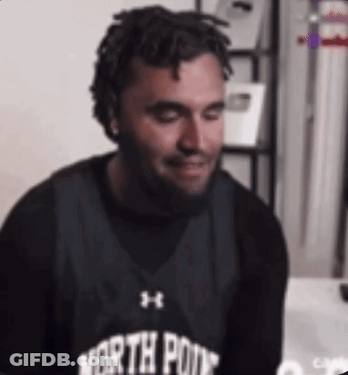 A Man With Dreadlocks And A Beard Wearing A North Point Basketball Jersey . GIF